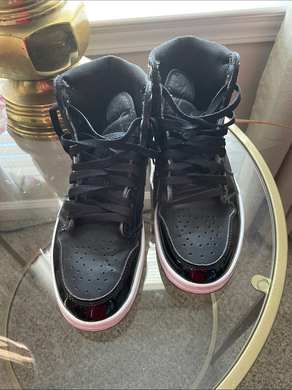 Jordan Women's Black Patent Leather High-Top Sneakers. No insole in shoe.